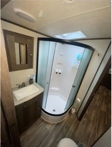 a view of a backyard with chairs and a fire pit