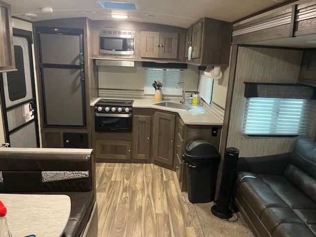 669 Highway 9 Cape May, NJ 08204 - Photo 3 of 18 a kitchen with stainless steel appliances granite countertop a refrigerator a stove and a sink