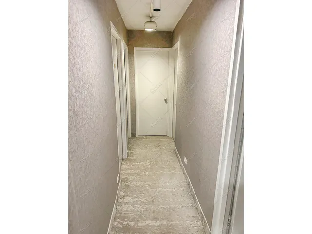 a view of a hallway with a white walls