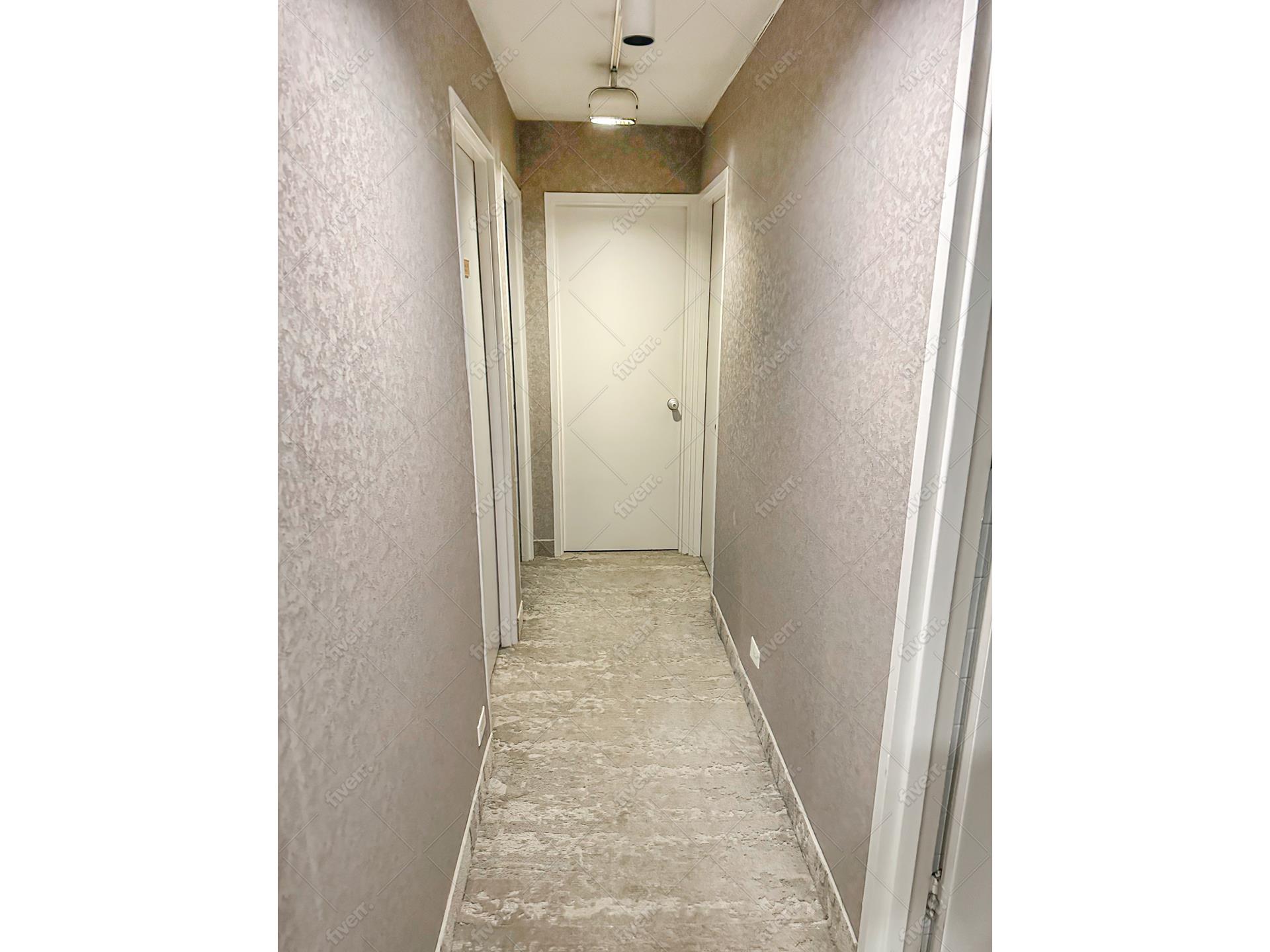 750 Park Avenue, Unit 1C Manhattan, NY 10021 - Photo 5 of 13 a view of a hallway with a white walls