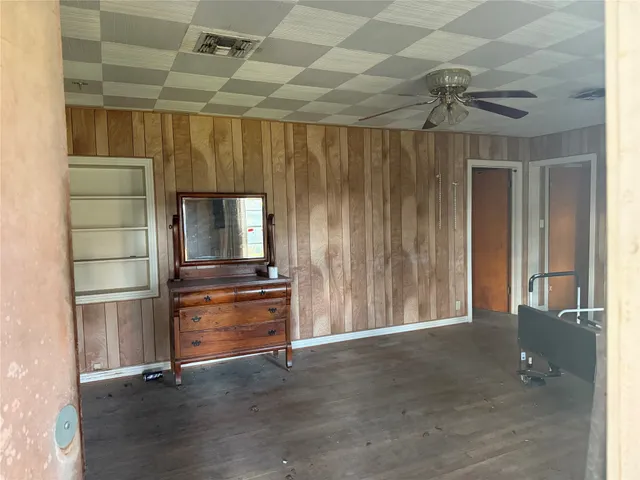 a room with closet and wooden floor