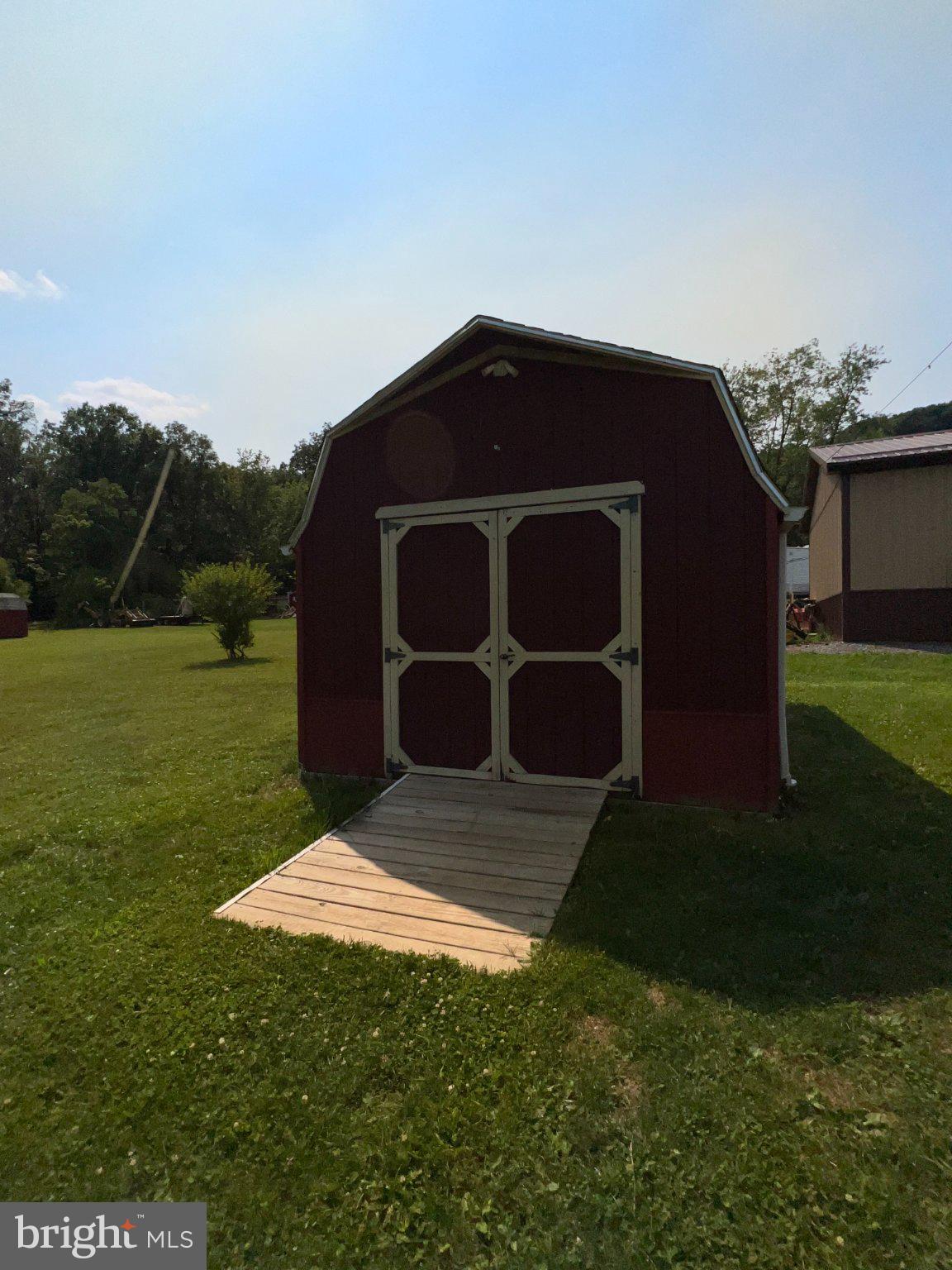 101 Fair Haven Street Ridgeley, WV 26753 - Photo 29 of 29 Charming red shed on a sunny day.
