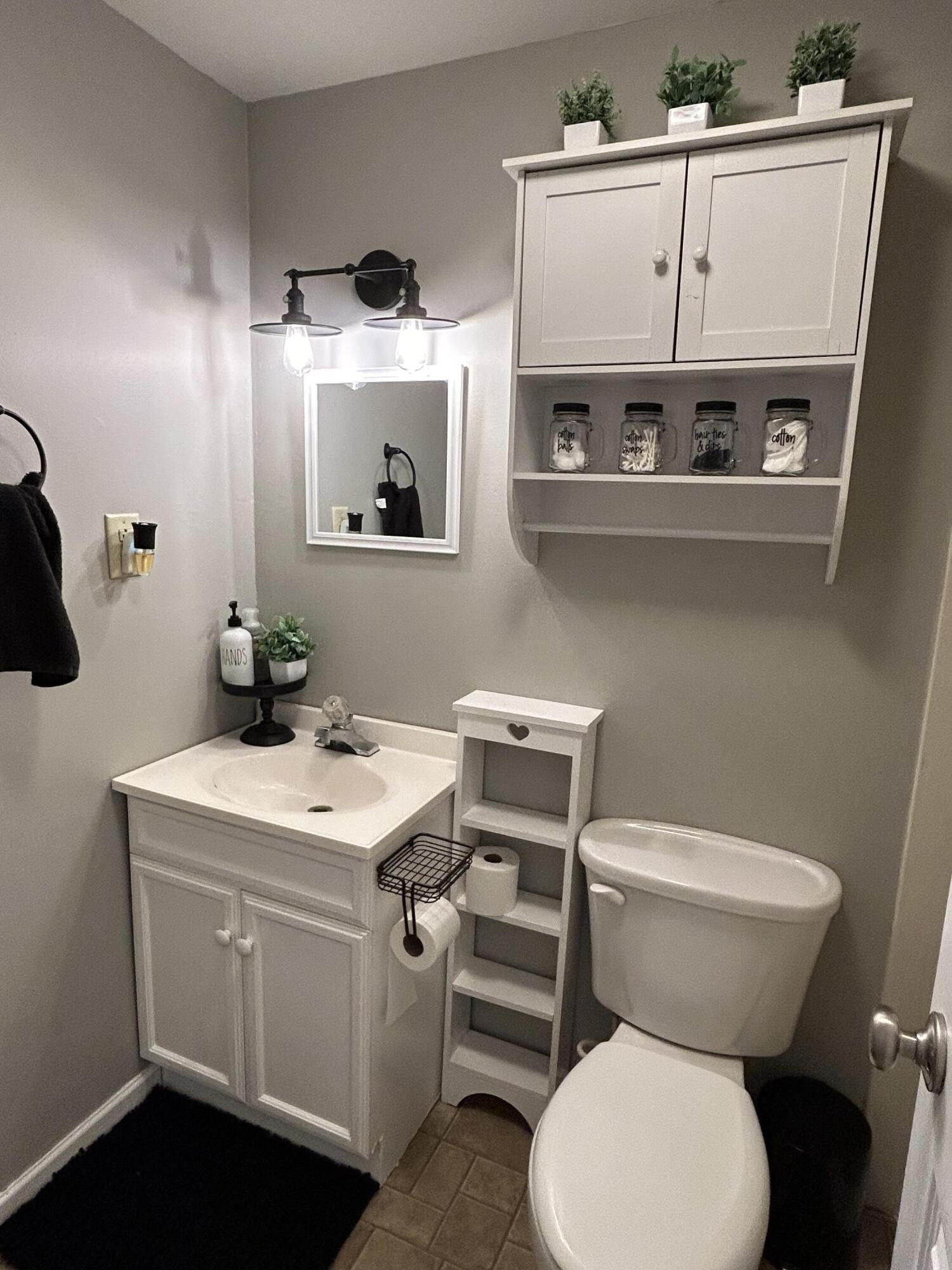 502 North Webster Street Rensselaer, IN 47978 - Photo 17 of 35 a bathroom with a sink a toilet and mirror