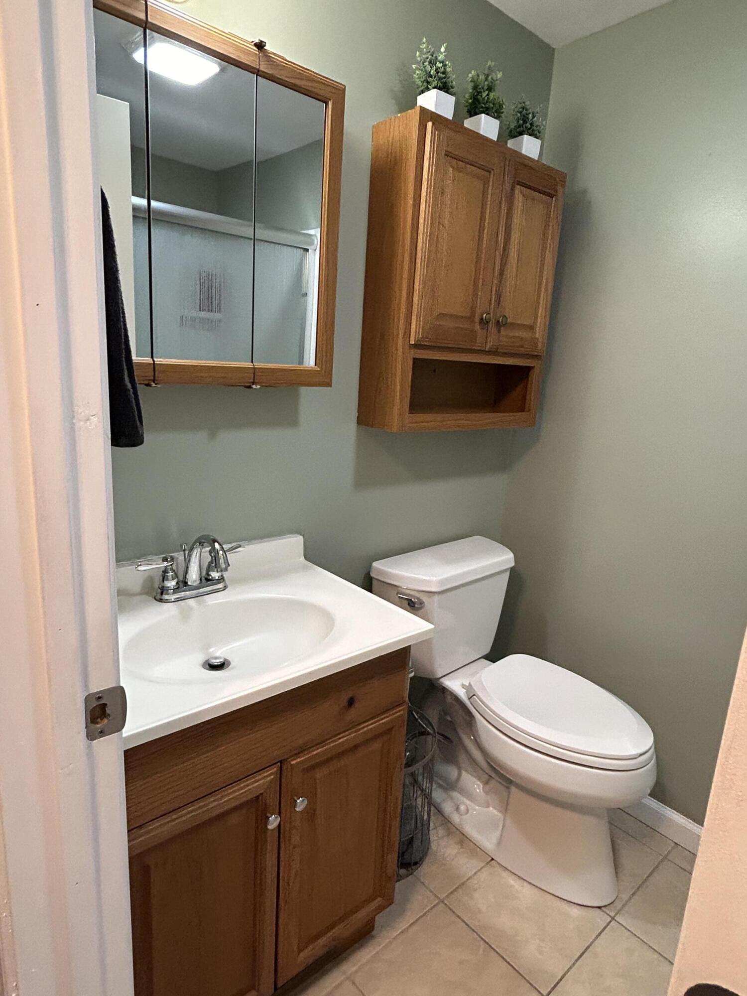 502 North Webster Street Rensselaer, IN 47978 - Photo 24 of 35 a bathroom with a toilet sink and mirror