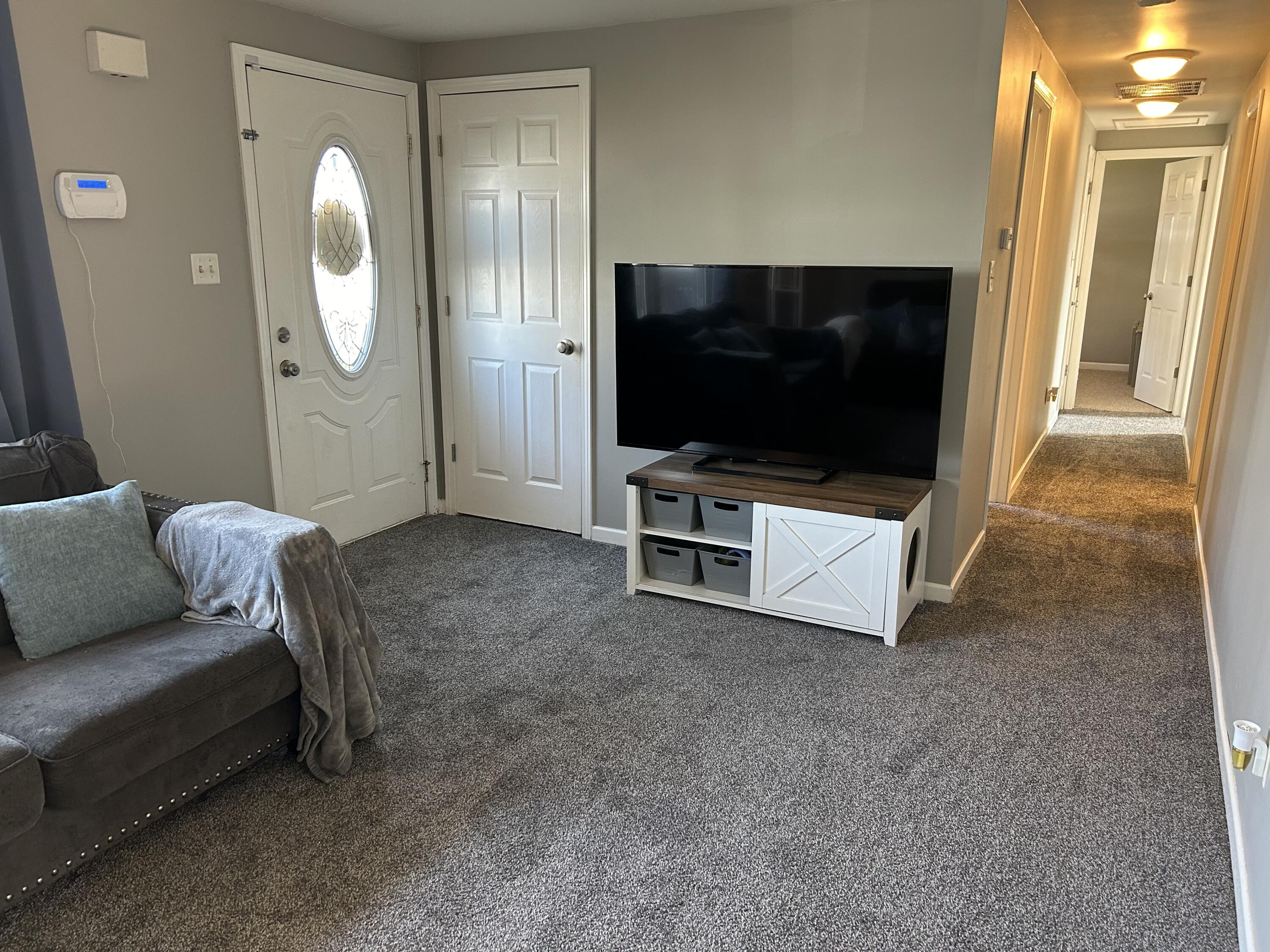 502 North Webster Street Rensselaer, IN 47978 - Photo 5 of 35 a living room with furniture and a flat screen tv