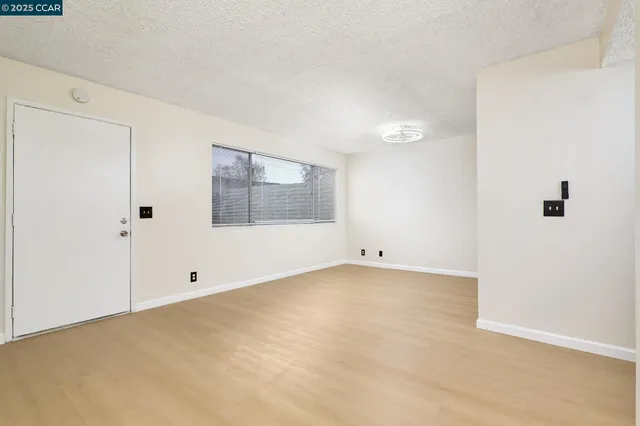 a kitchen with a sink and a refrigerator