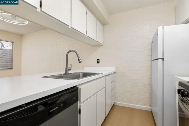a kitchen with a stove and a refrigerator