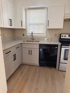 1725 Sturgeon Road Buford, GA 30518 - Photo 4 of 14 a kitchen with granite countertop a stove sink and cabinets