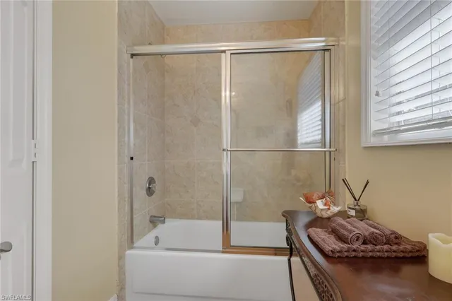a bathroom with a sink and shower