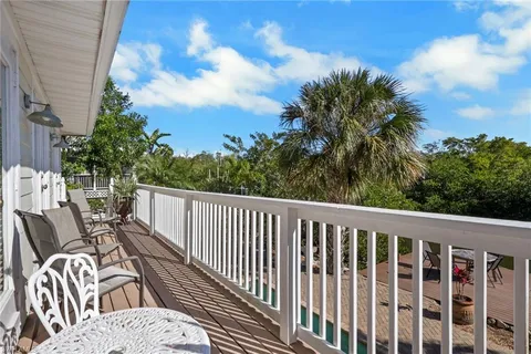 a view of balcony with furniture