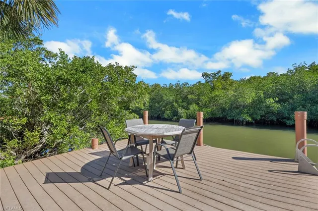 a view of a backyard with sitting area