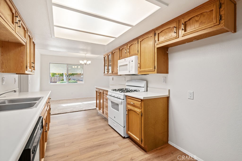 1766 Shepherd Drive Paso Robles, CA 93446 - Photo 11 of 29 a kitchen with stainless steel appliances granite countertop a sink stove and refrigerator