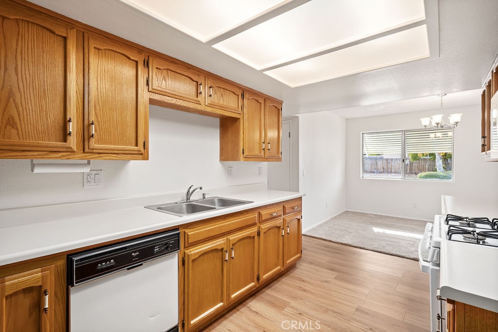 1766 Shepherd Drive Paso Robles, CA 93446 - Photo 12 of 29 a kitchen with stainless steel appliances granite countertop a sink stove and cabinets