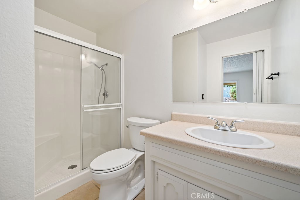 1766 Shepherd Drive Paso Robles, CA 93446 - Photo 24 of 29 a bathroom with a sink toilet and shower