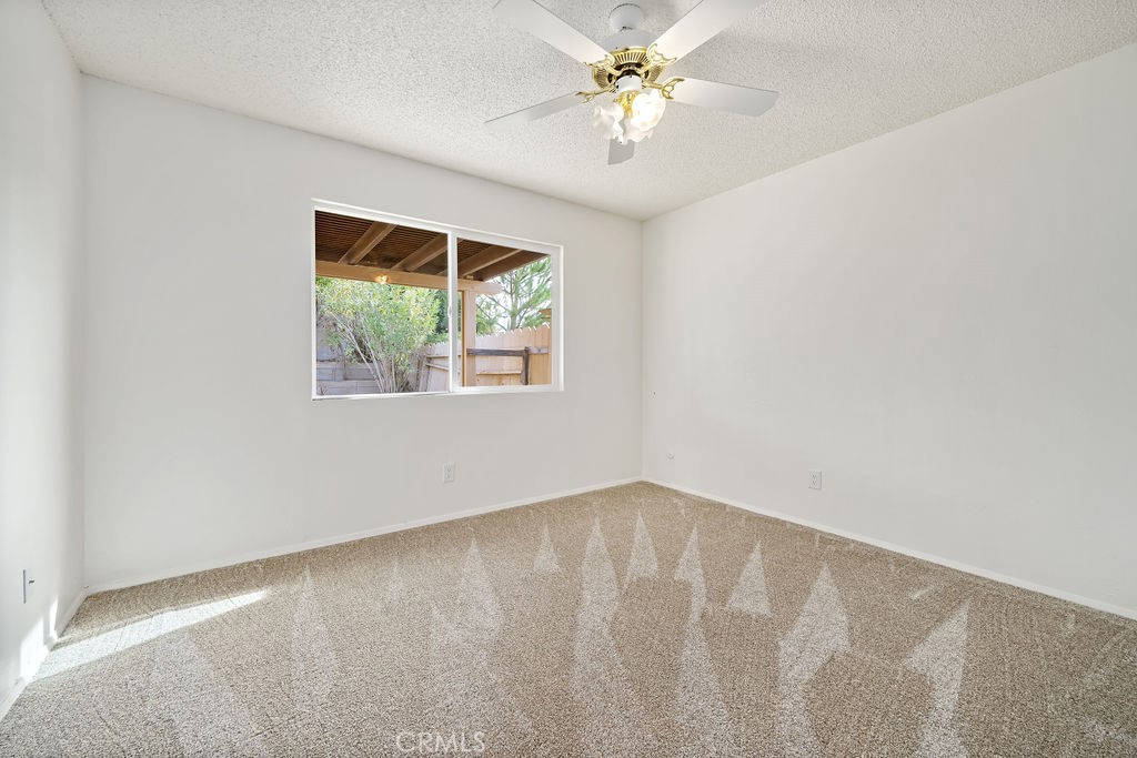 1766 Shepherd Drive Paso Robles, CA 93446 - Photo 25 of 29 an empty room with a window and a fan