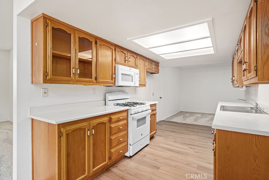1766 Shepherd Drive Paso Robles, CA 93446 - Photo 9 of 29 a kitchen with stainless steel appliances granite countertop a sink and dishwasher a stove with wooden floor