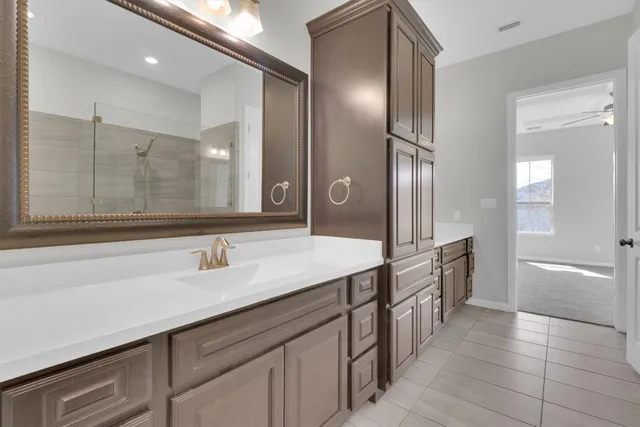 a view of an empty room with a ceiling fan