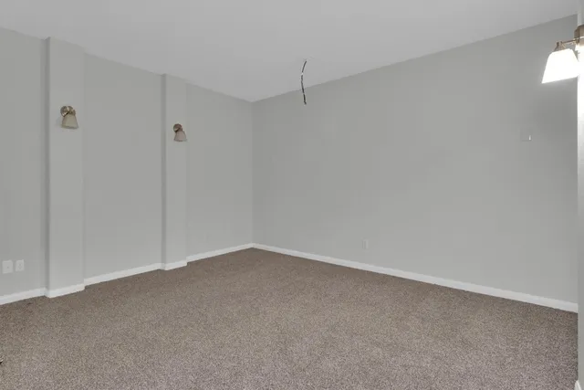 an empty room with closet area