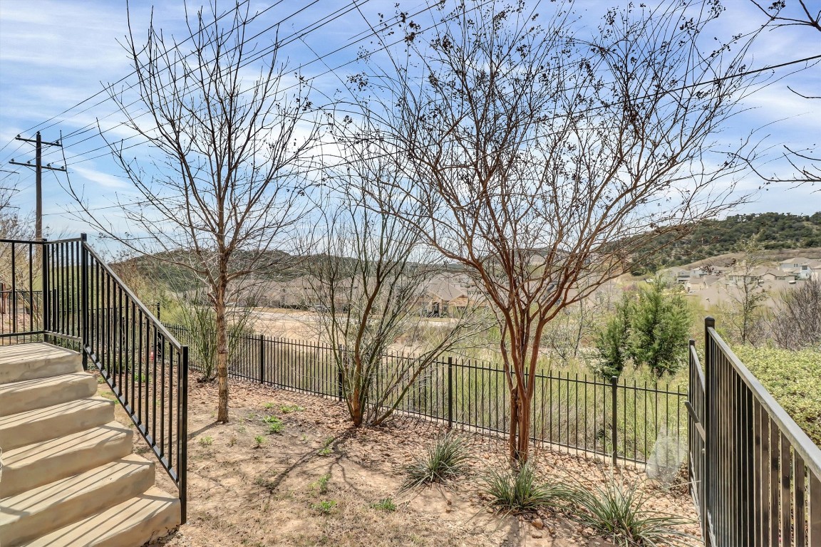 201 Cartwheel Bend, Unit 30 Austin, TX 78738 - Photo 29 of 40 a view of a yard covered with snow in the yard