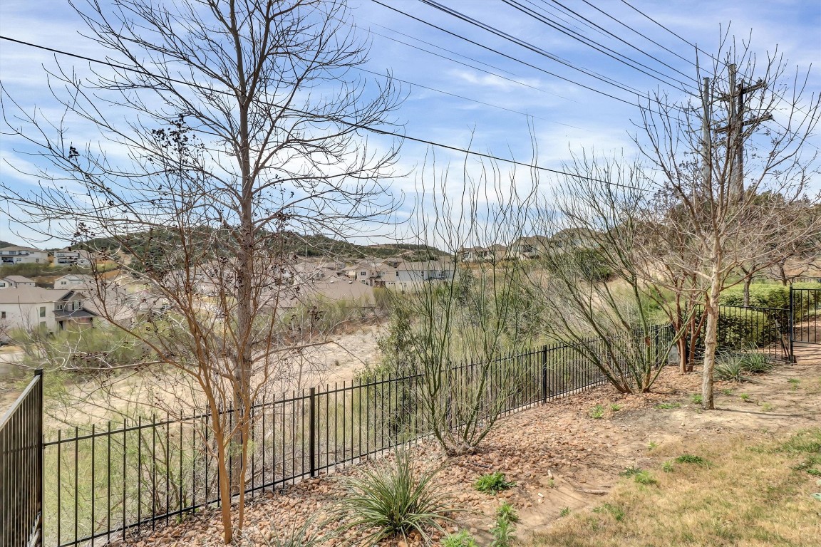 201 Cartwheel Bend, Unit 30 Austin, TX 78738 - Photo 30 of 40 a view of a yard with trees