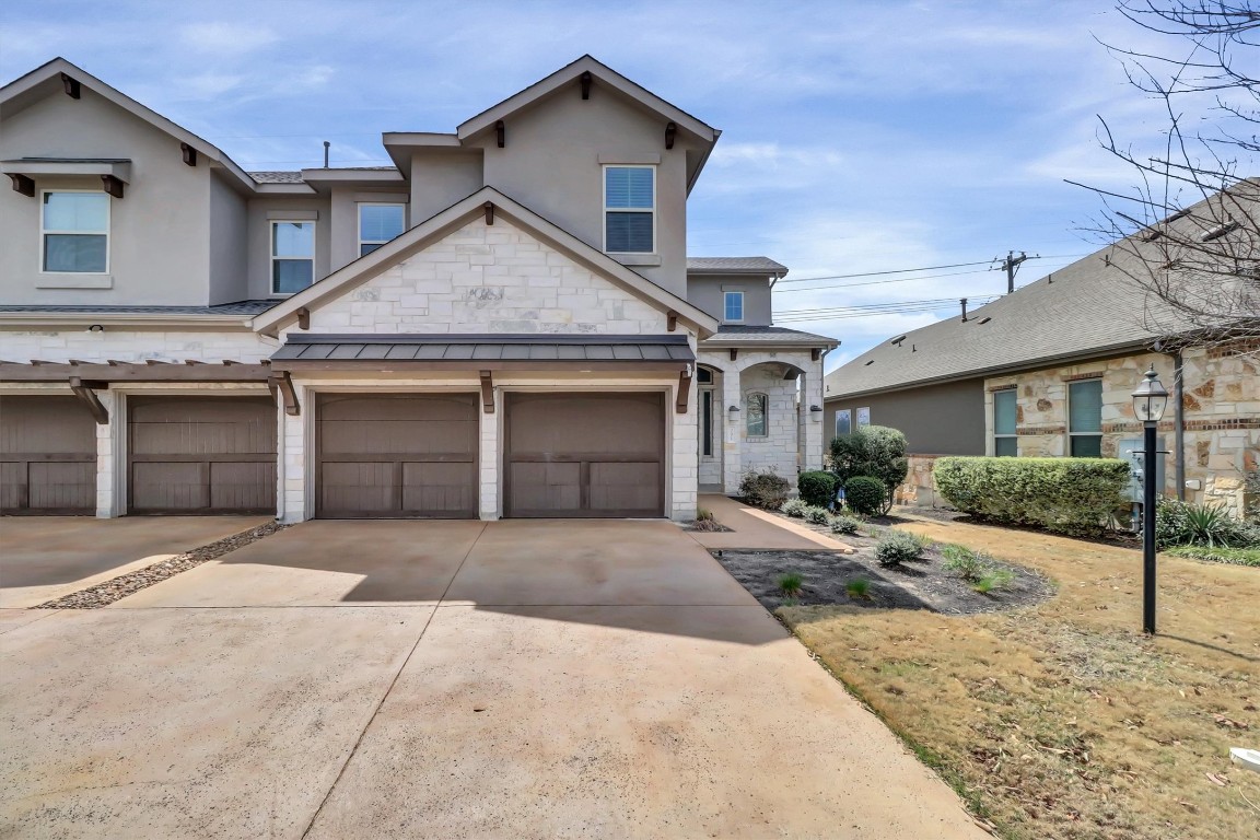 201 Cartwheel Bend, Unit 30 Austin, TX 78738 - Photo 33 of 40 a front view of a house with yard