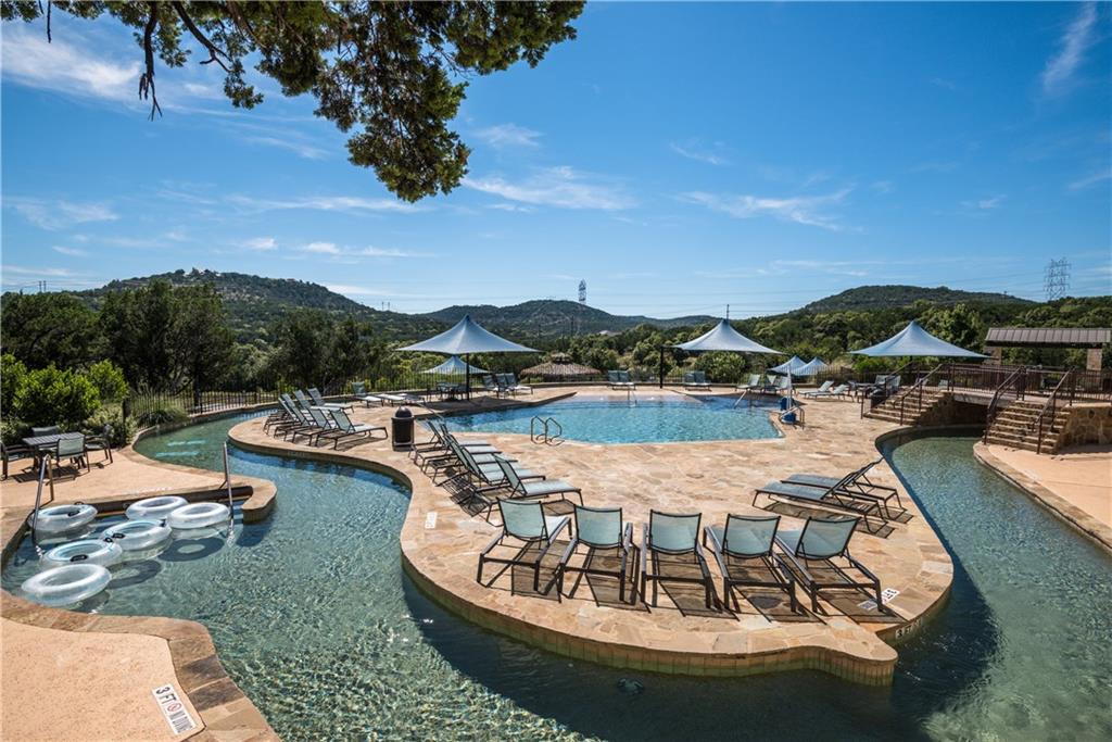 201 Cartwheel Bend, Unit 30 Austin, TX 78738 - Photo 35 of 40 a view of a lake with a mountain