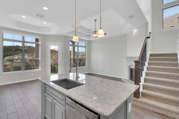 a view of a park with couches and table