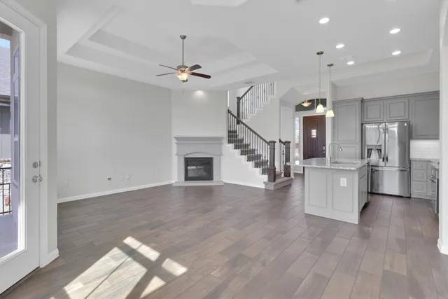 a view of a park with couches and table