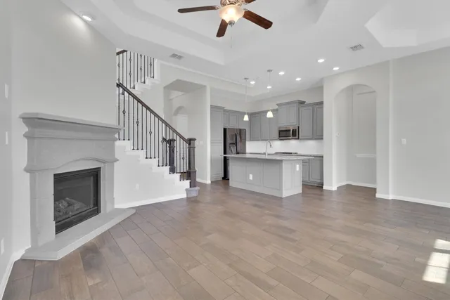 a view of kitchen with furniture and stainless steel appliances