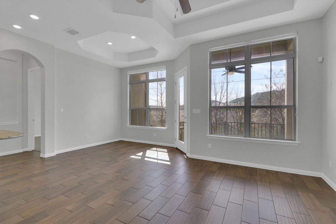 201 Cartwheel Bend, Unit 30 Austin, TX 78738 - Photo 8 of 40 a view of an empty room with glass door and windows
