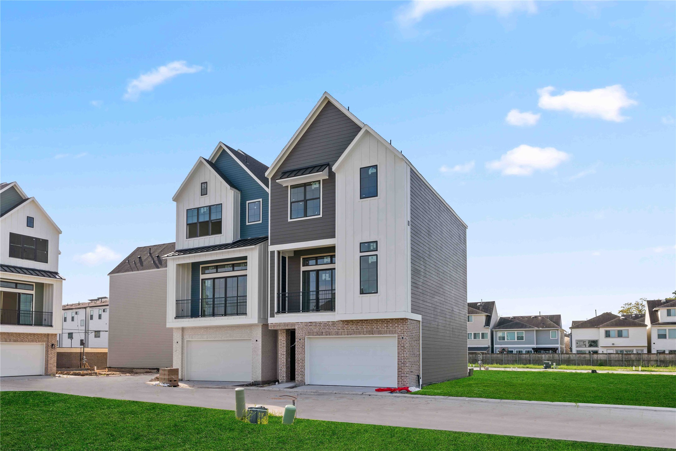 8705 Cosenza Lane Houston, TX 77055 - Photo 2 of 12 a front view of white house with a yard and garage
