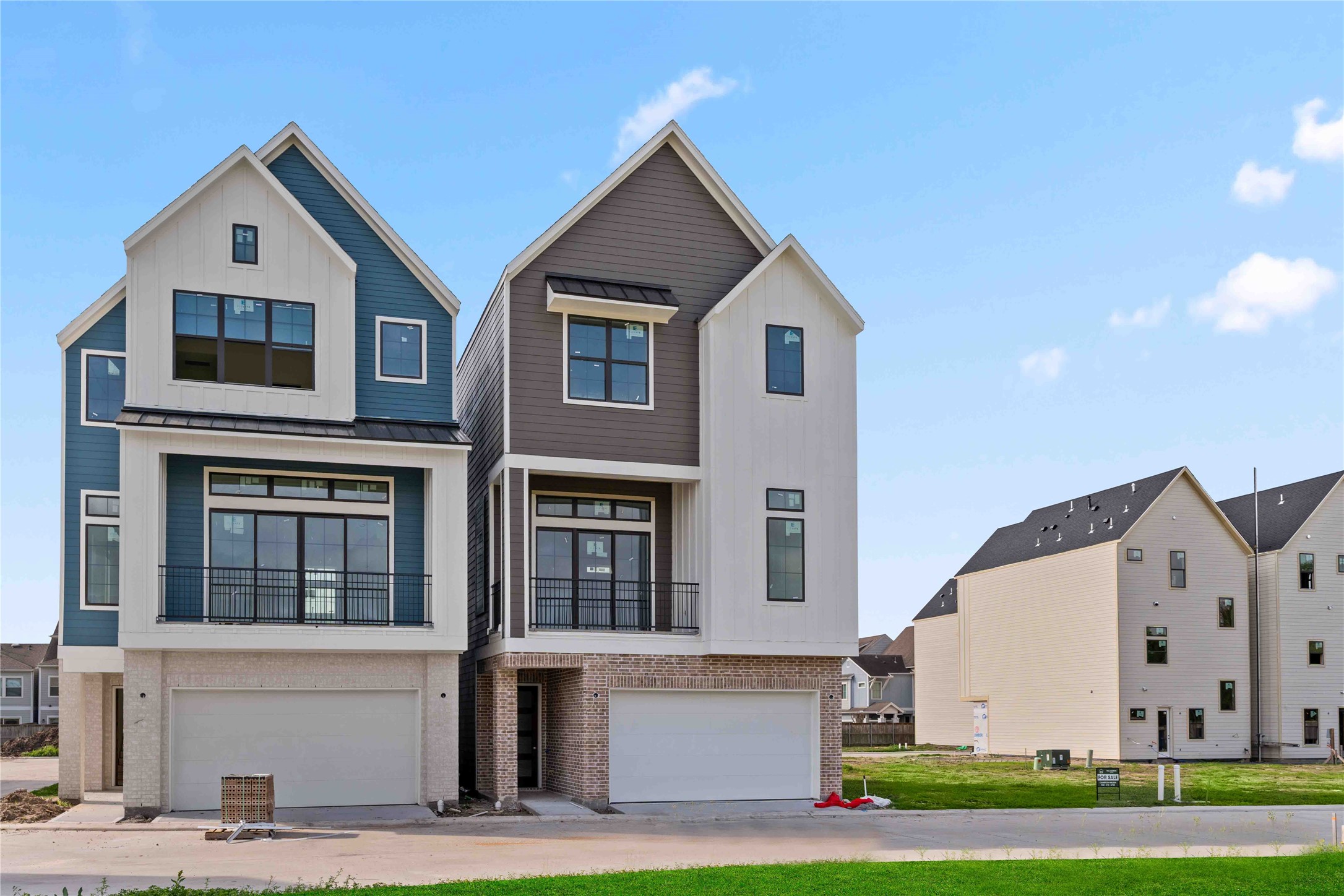 8705 Cosenza Lane Houston, TX 77055 - Photo 4 of 12 a view of a white house with large windows and a yard