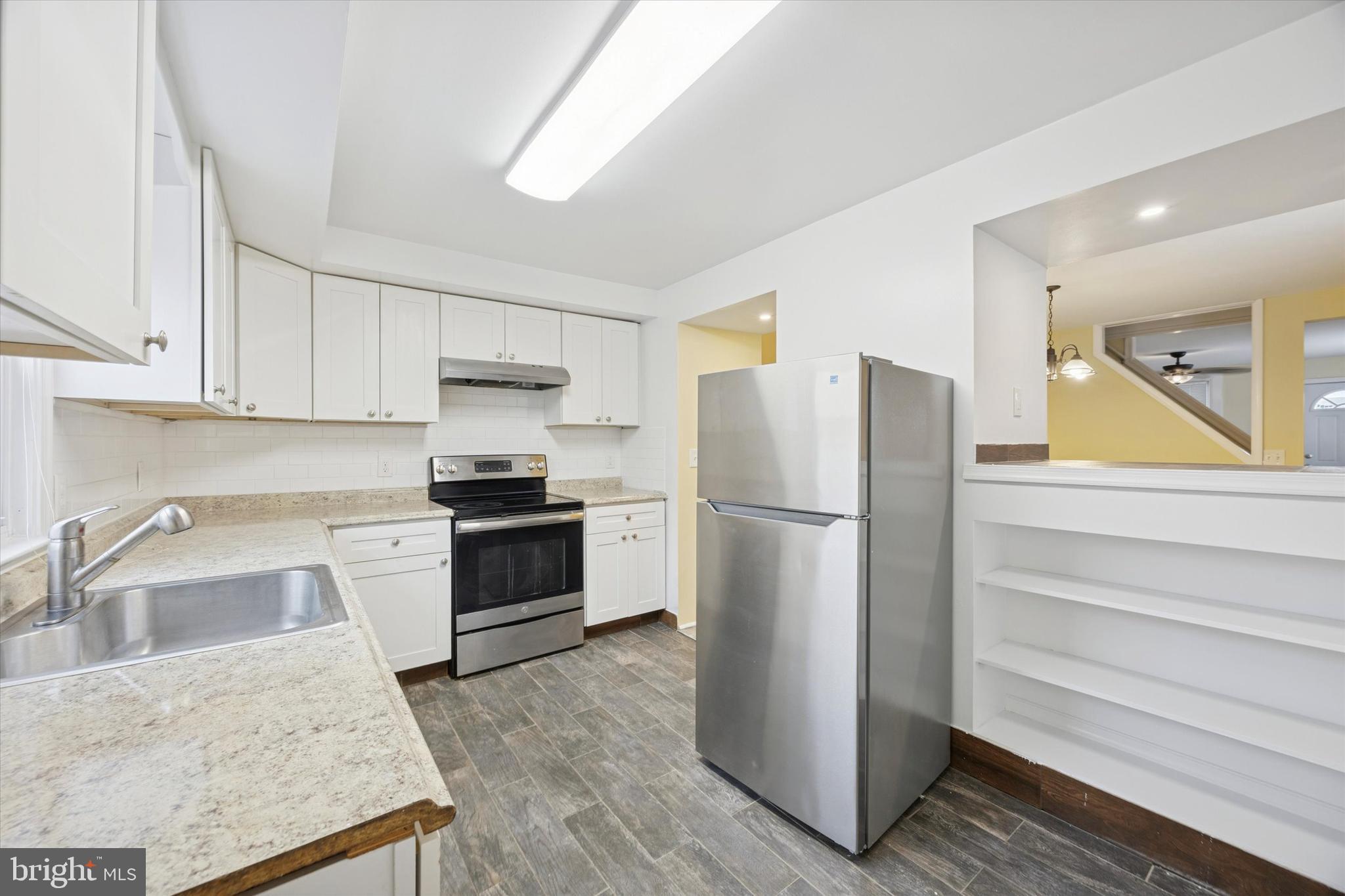 68 South Union Avenue Lansdowne, PA 19050 - Photo 6 of 15 a kitchen with a refrigerator sink and stove