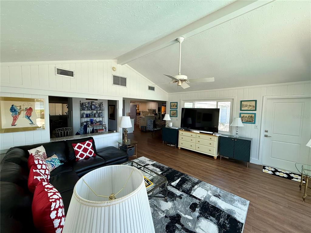 3534 Casey Key Road Nokomis, FL 34275 - Photo 11 of 55 a living room with furniture and a flat screen tv