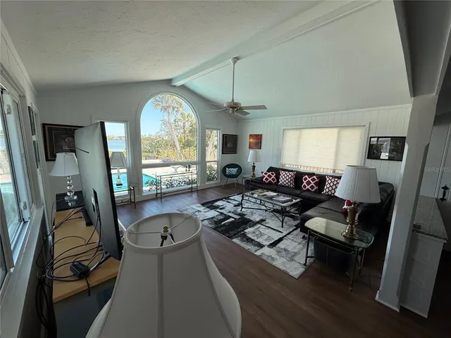 a kitchen with stainless steel appliances kitchen island granite countertop a refrigerator and a stove top oven