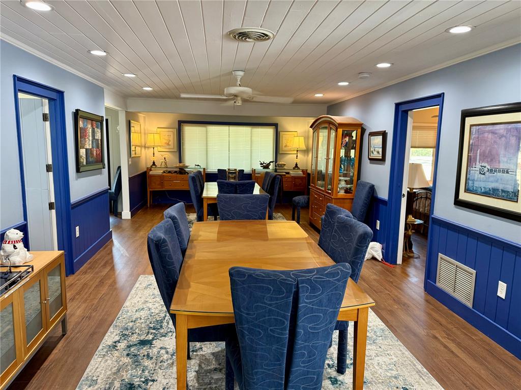 3534 Casey Key Road Nokomis, FL 34275 - Photo 19 of 55 a view of a dining room with furniture window and wooden floor