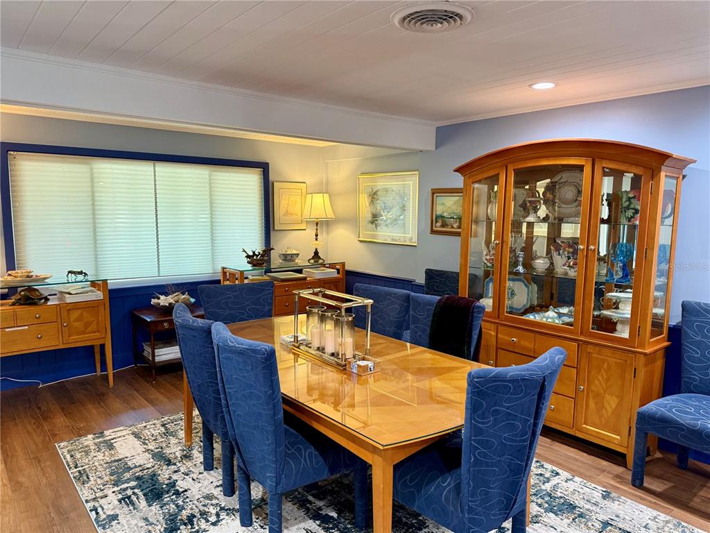 3534 Casey Key Road Nokomis, FL 34275 - Photo 20 of 55 a view of a dining room with furniture window and wooden floor