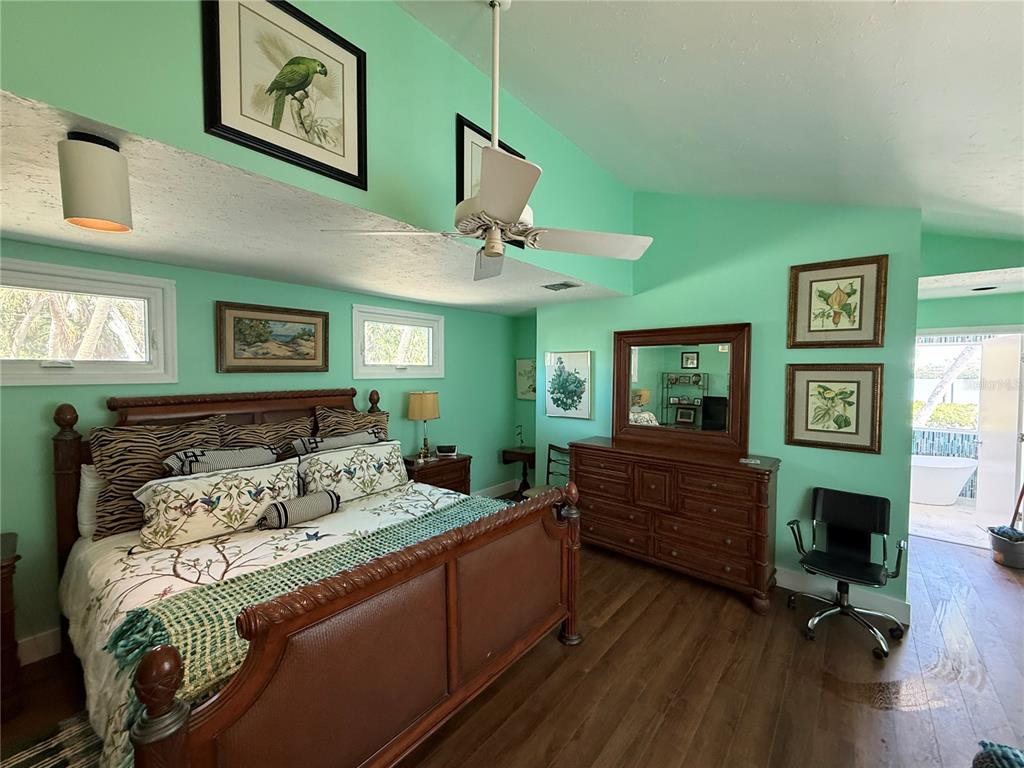 3534 Casey Key Road Nokomis, FL 34275 - Photo 22 of 55 a bed room with furniture and a large window