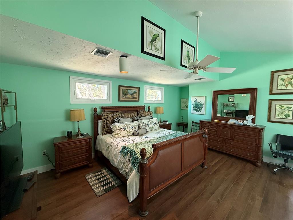 3534 Casey Key Road Nokomis, FL 34275 - Photo 24 of 55 a bedroom with a bed window and a dresser