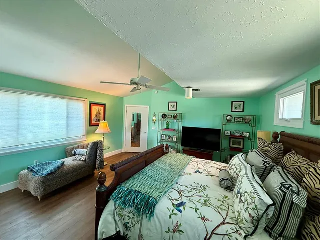 a spacious bathroom with a double vanity sink a mirror and a shower