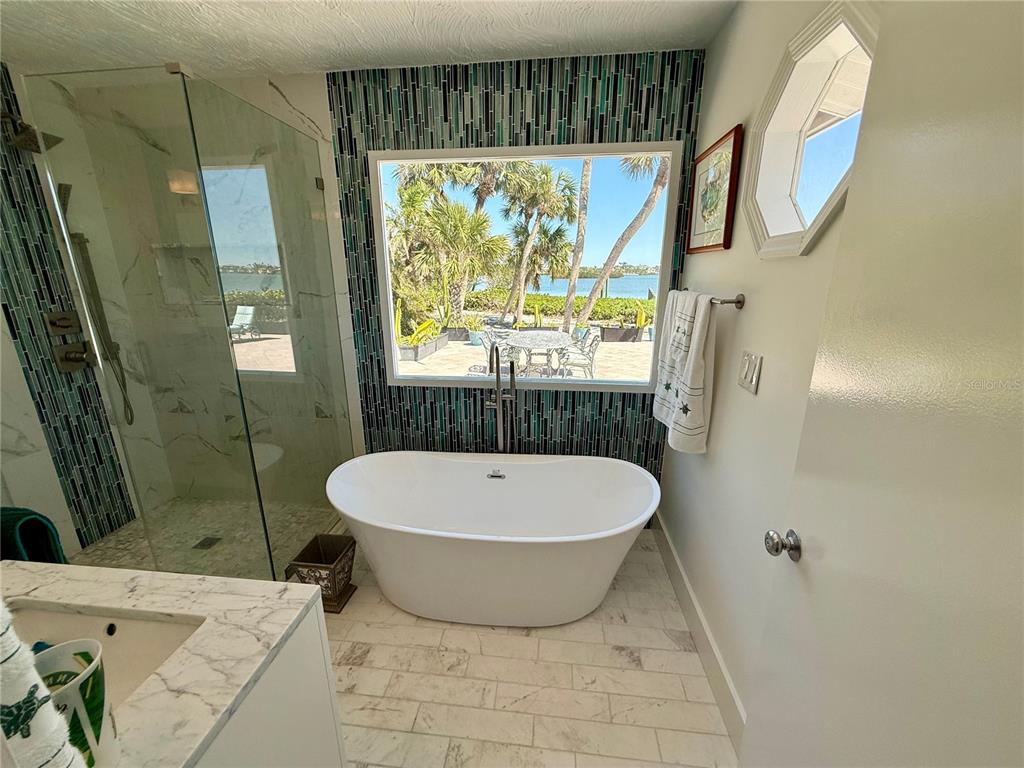 3534 Casey Key Road Nokomis, FL 34275 - Photo 28 of 55 a bathroom with a sink and a mirror