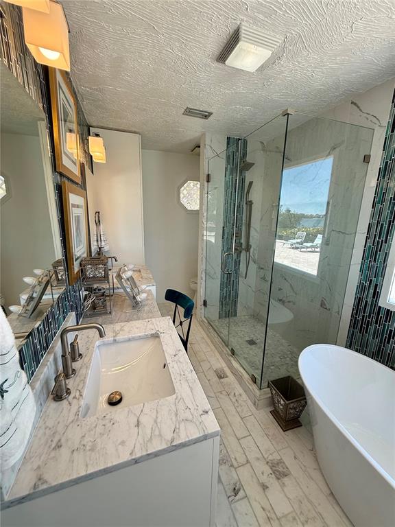 3534 Casey Key Road Nokomis, FL 34275 - Photo 30 of 55 a bathroom with a sink a toilet a mirror and shower