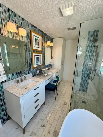 a bathroom with a sink and mirror