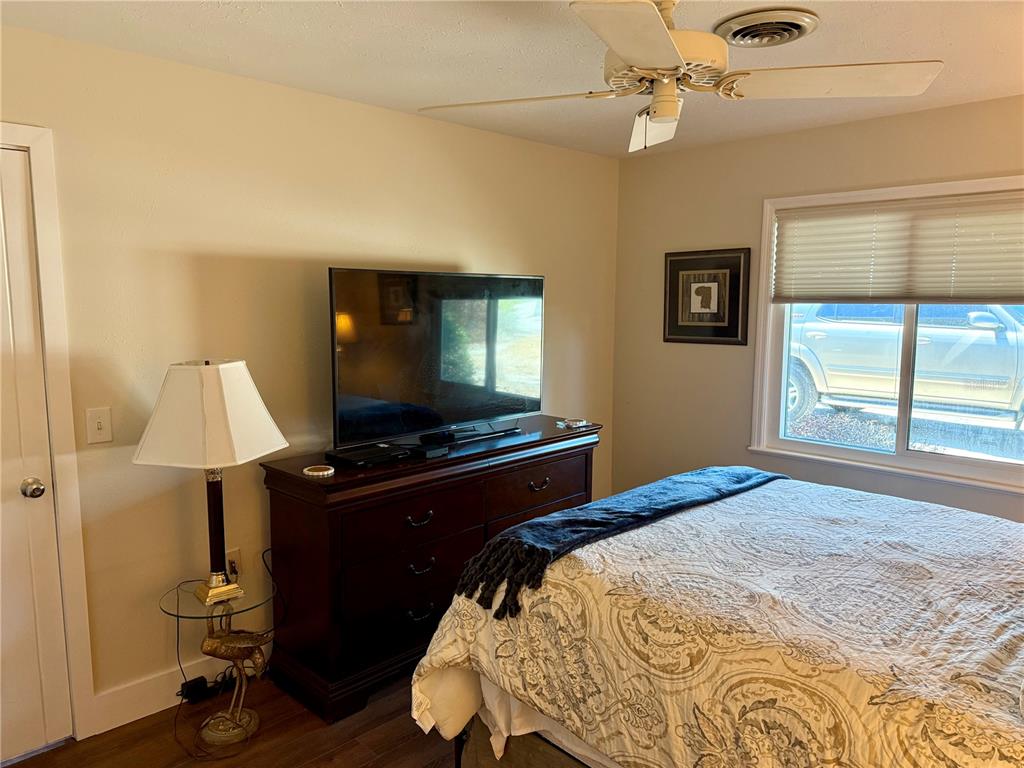 3534 Casey Key Road Nokomis, FL 34275 - Photo 35 of 55 a bedroom with a bed and a flat screen tv