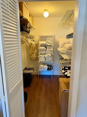 a bathroom with a toilet a sink and a mirror