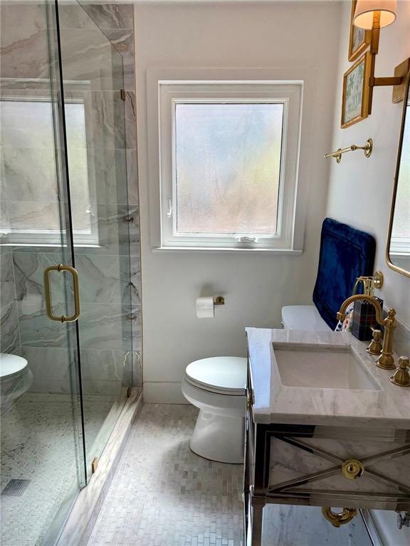 3534 Casey Key Road Nokomis, FL 34275 - Photo 41 of 55 a bathroom with a toilet a sink and a mirror