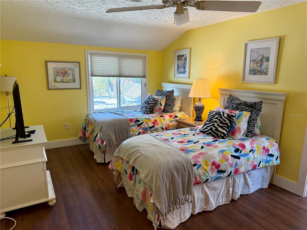 3534 Casey Key Road Nokomis, FL 34275 - Photo 42 of 55 a bedroom with a bed and a window