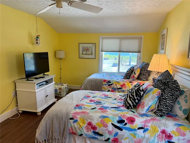 a view of a house with swimming pool and furniture