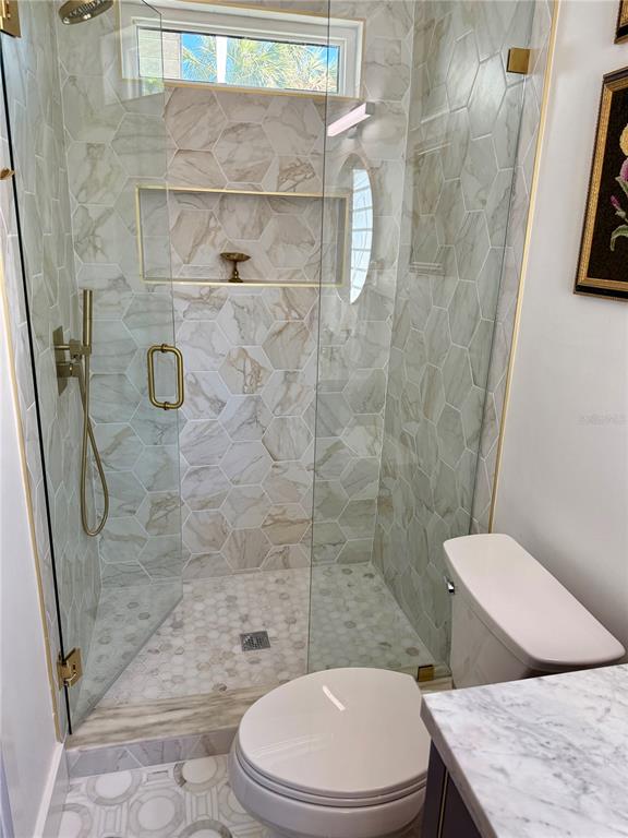 3534 Casey Key Road Nokomis, FL 34275 - Photo 47 of 55 a white toilet and shower