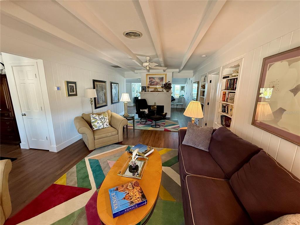 3534 Casey Key Road Nokomis, FL 34275 - Photo 6 of 55 a living room with furniture and a chandelier
